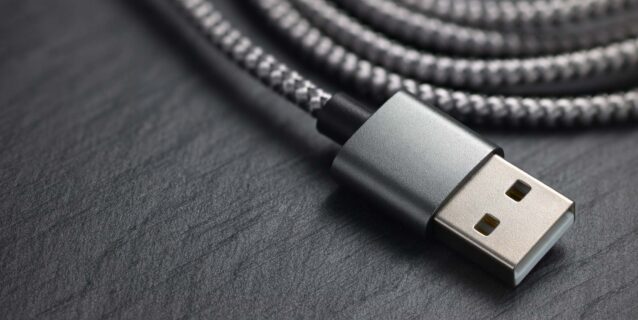 A USB cable with a silver connector and braided cable.